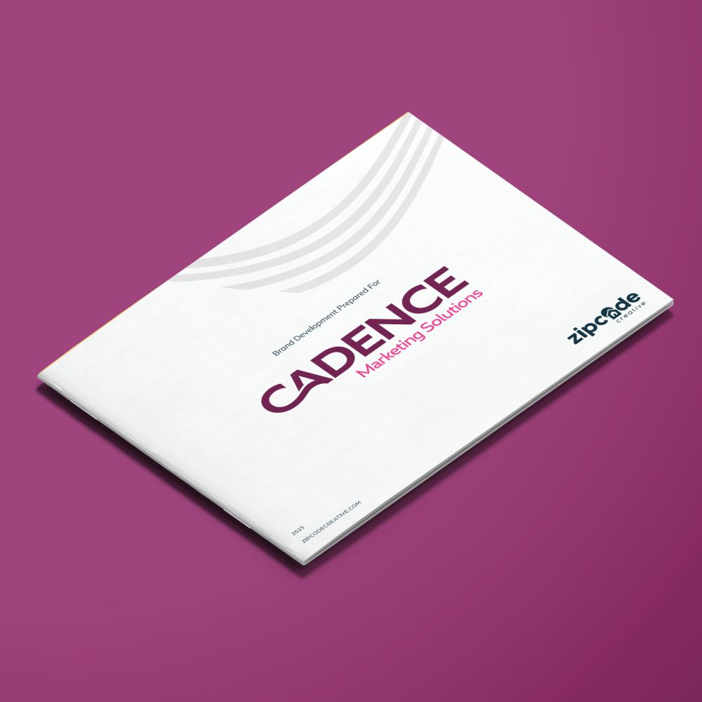 Angled mockup of the Cadence Marketing Solutions brand guidelines document cover, featuring the plum and pink wordmark on a white background against a plum backdrop