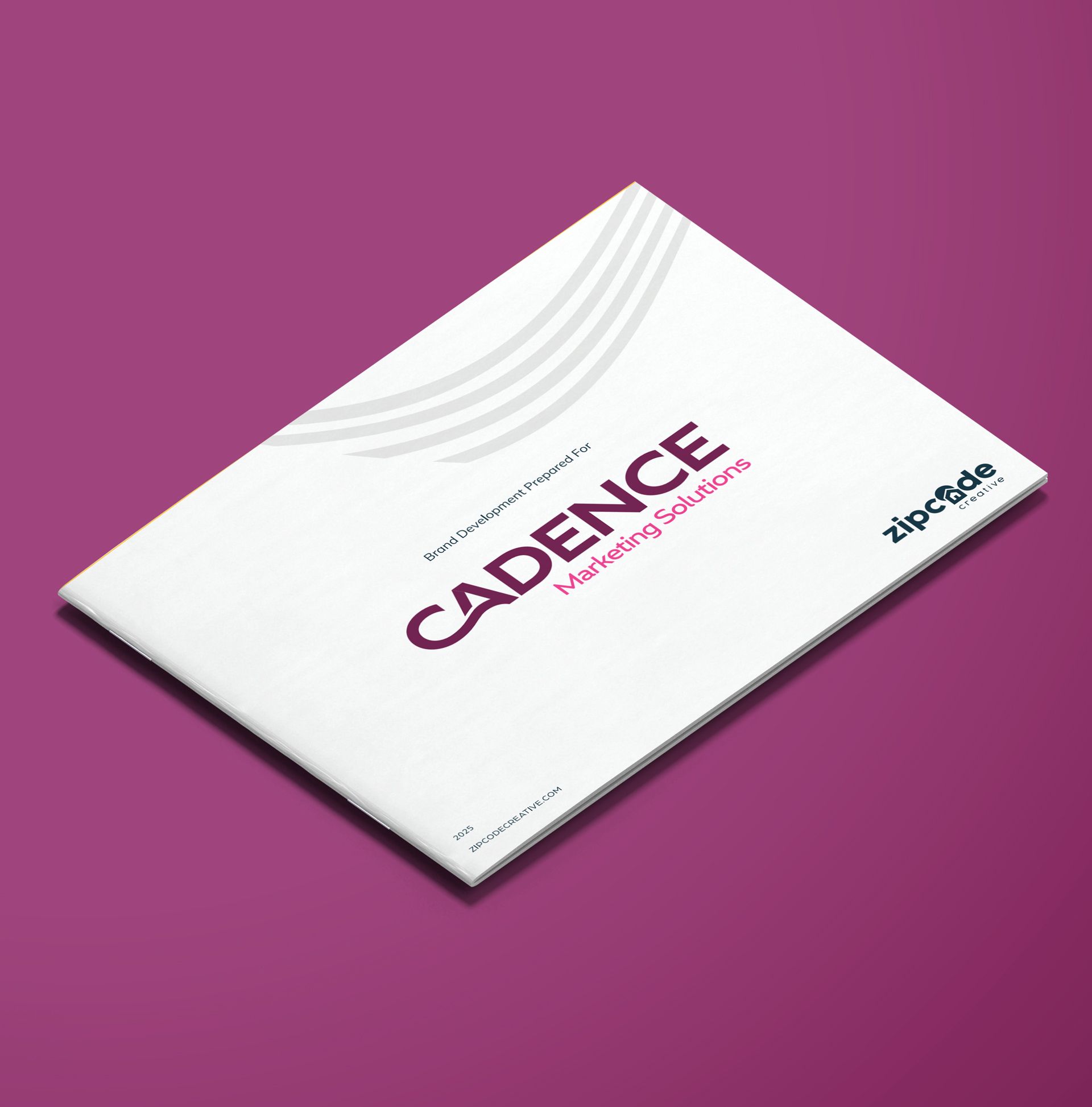Angled mockup of the Cadence Marketing Solutions brand guidelines document cover, featuring the plum and pink wordmark on a white background against a plum backdrop