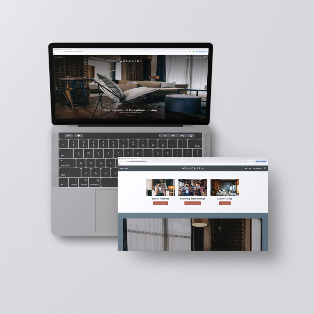 Laptop and tablet displaying Jonah Digital Woodlark apartment website template with luxury community room photo, custom typography, and branded color scheme showcasing stylish interiors and stunning surroundings