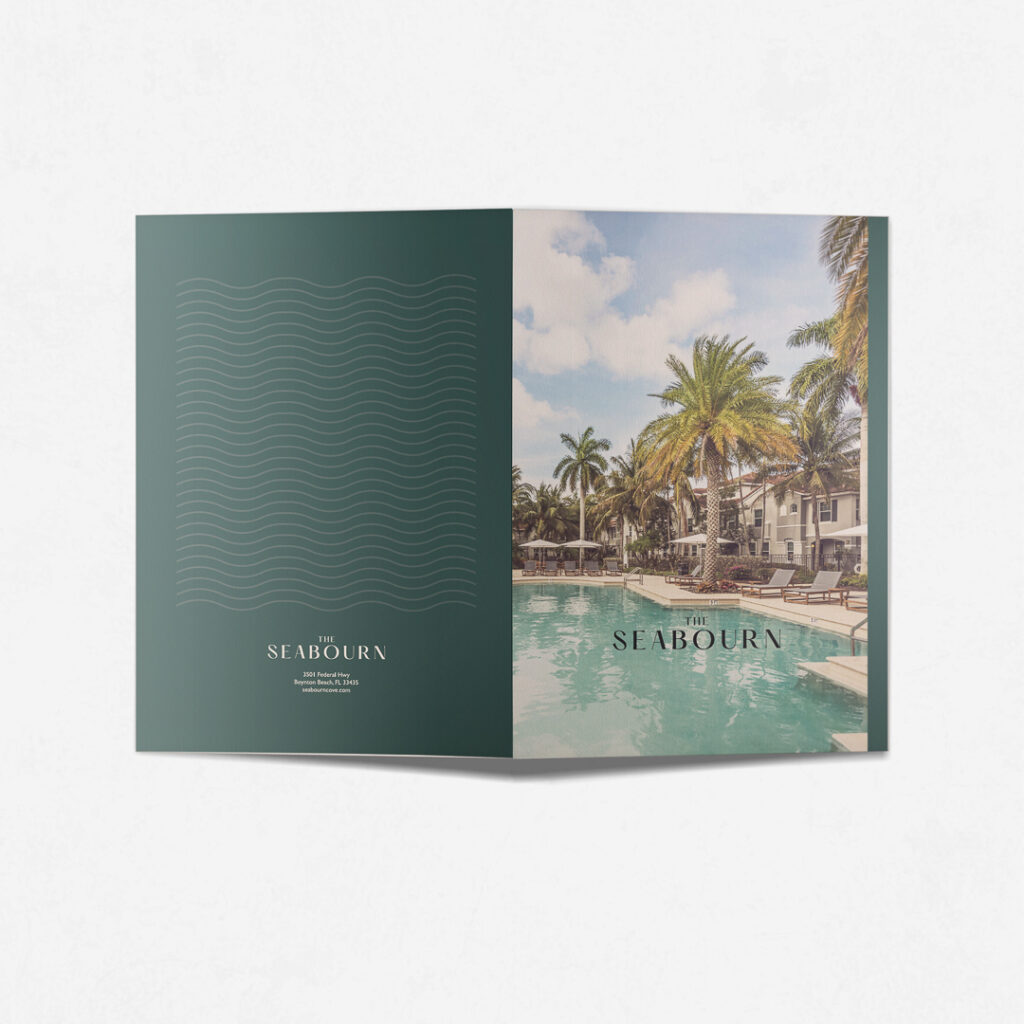 The Seabourn branded presentation folder featuring teal wave pattern and pool photography demonstrating cohesive apartment community marketing materials