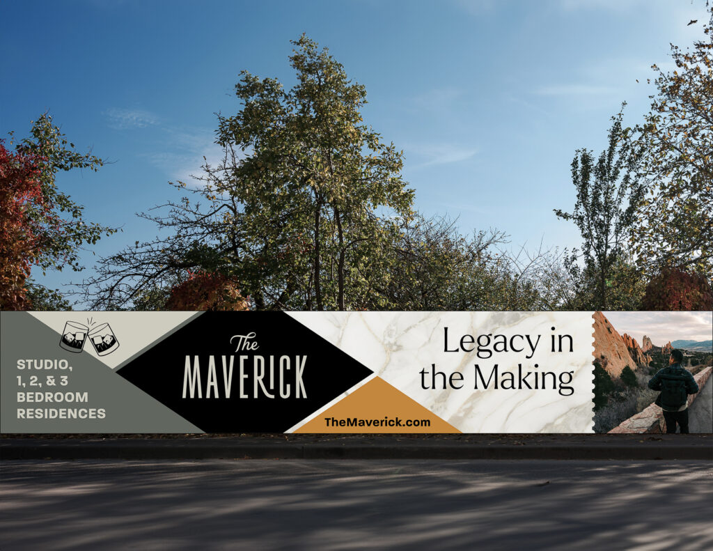 The Maverick construction fence banner with marble, black, and gold geometric panels reading "Legacy in the Making" alongside studio, 1, 2, & 3 bedroom residence details